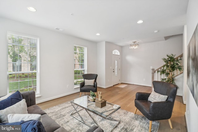 living room with light hardwood / wood-style floors and a wealth of natural light