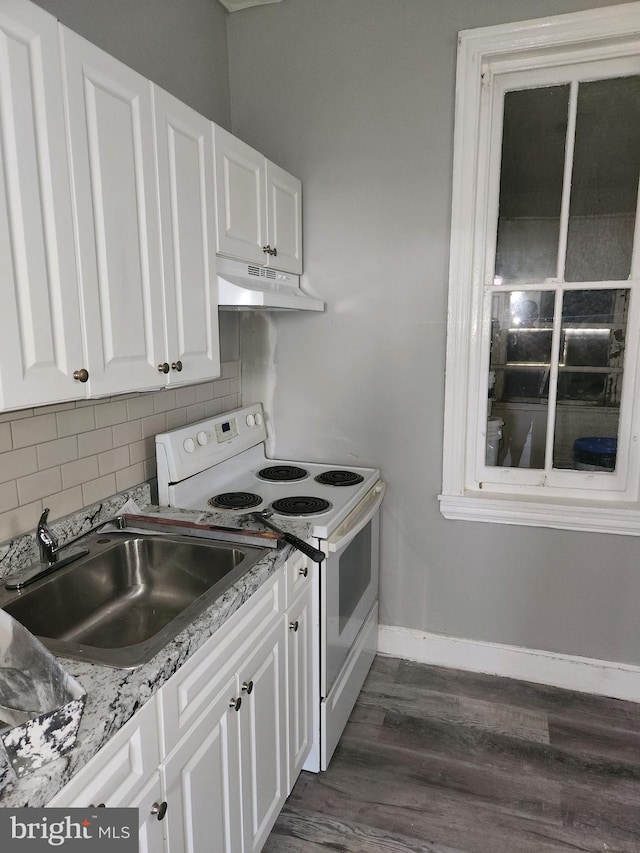 kitchen featuring dark hardwood / wood-style flooring, light stone counters, sink, electric range, and white cabinets