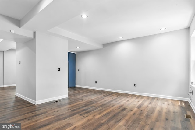 spare room with dark wood-type flooring