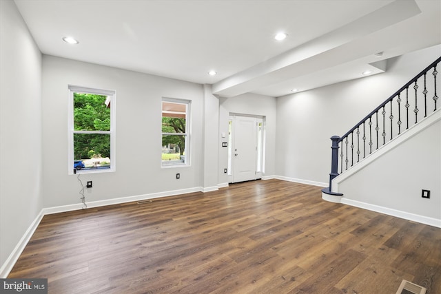 entryway with dark wood-type flooring