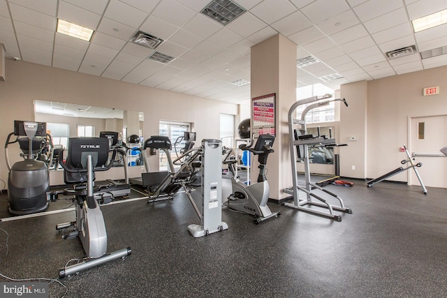 workout area with a paneled ceiling