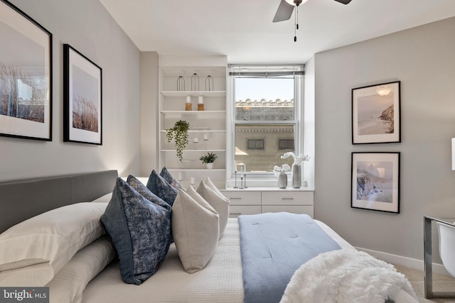 bedroom with ceiling fan and carpet flooring