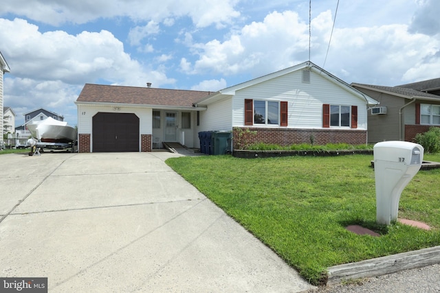 ranch-style home with a front yard, concrete driveway, an AC wall unit, a garage, and brick siding