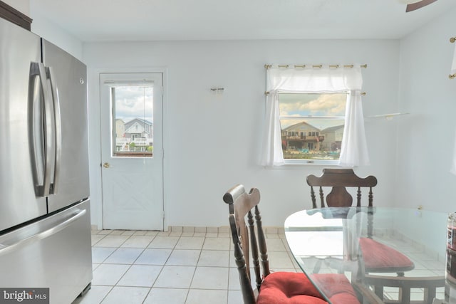 dining room featuring a wealth of natural light and light tile patterned floors