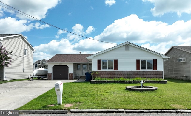 ranch-style house with a front lawn, brick siding, an attached garage, and driveway