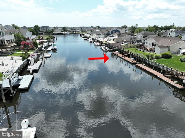 water view with a residential view and a boat dock