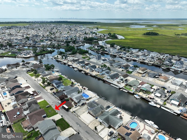 bird's eye view with a residential view and a water view