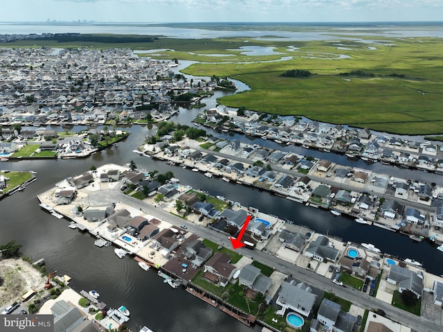 aerial view with a residential view and a water view