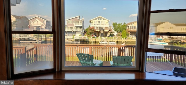 doorway to outside with a residential view