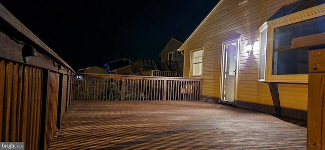 view of deck at twilight