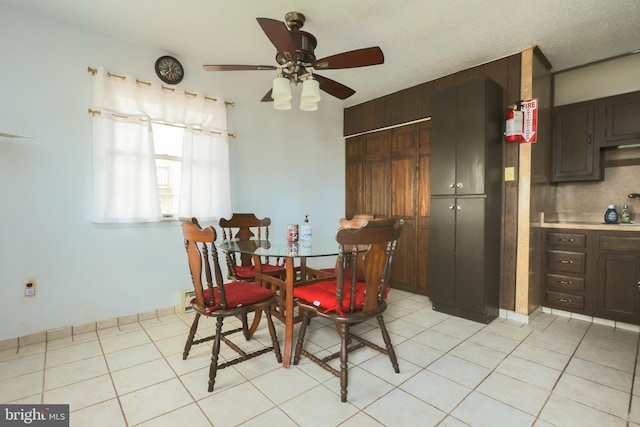 dining area with light tile patterned flooring and ceiling fan