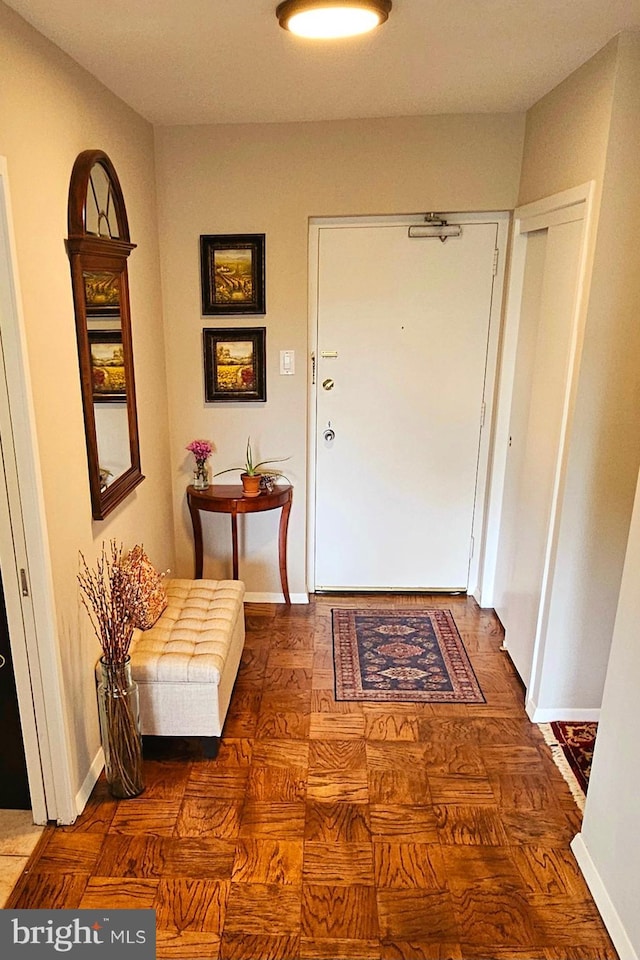 interior space featuring dark parquet flooring