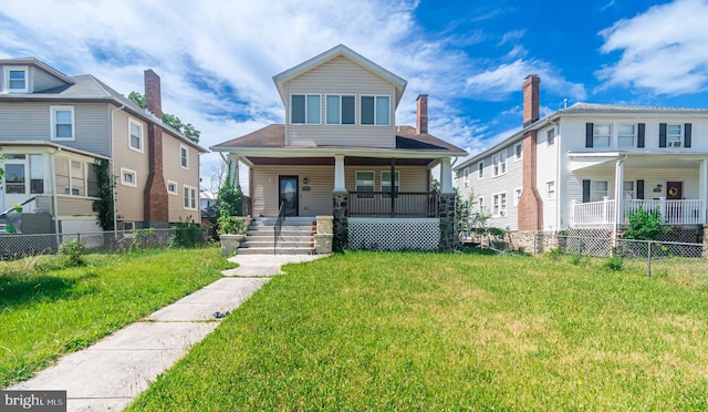 view of front of home featuring covered porch and a front lawn