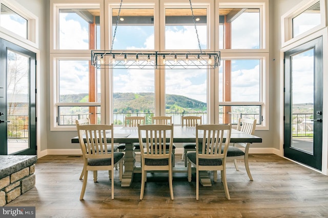 interior space featuring a wealth of natural light and a mountain view