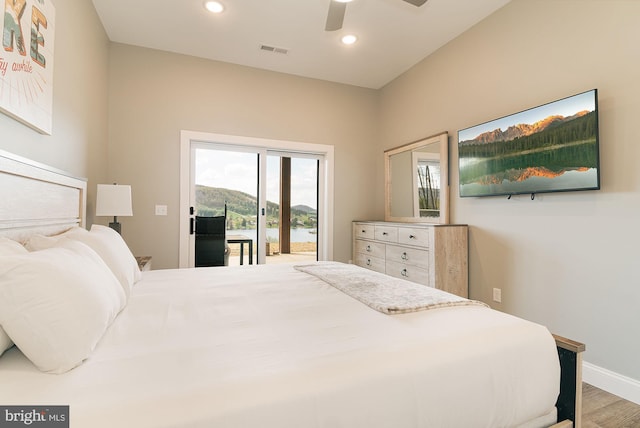 bedroom featuring access to outside, ceiling fan, and hardwood / wood-style floors