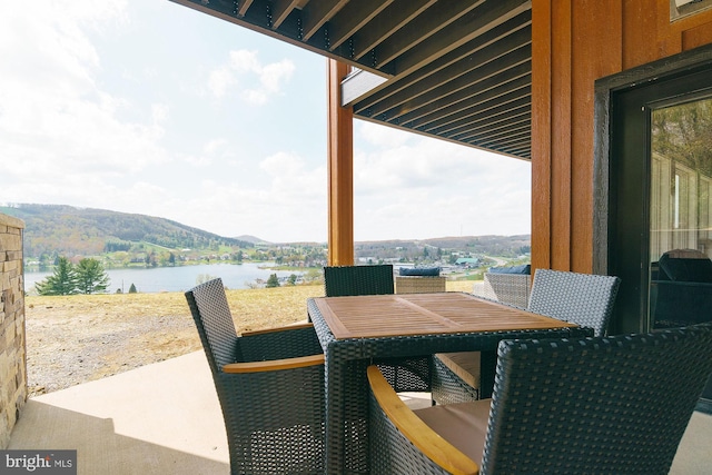 view of patio / terrace with a water view