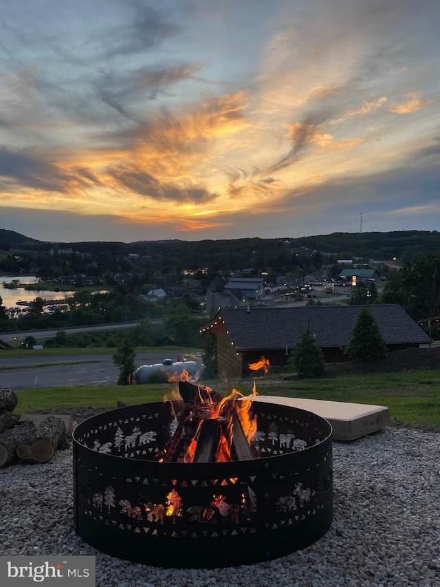 exterior space featuring an outdoor fire pit