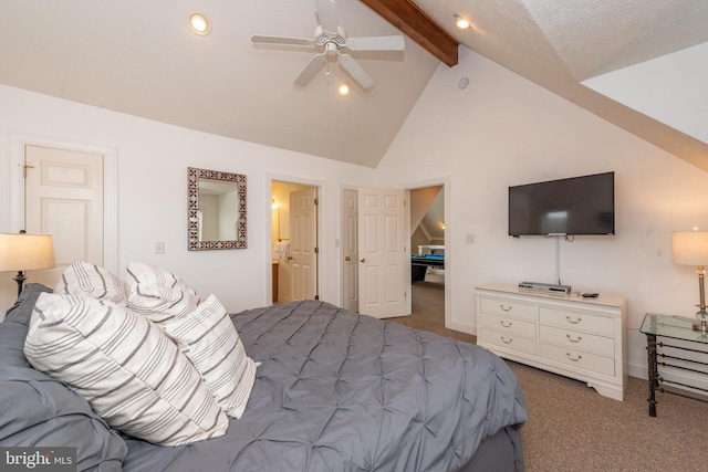 bedroom with ceiling fan, beam ceiling, carpet floors, and connected bathroom