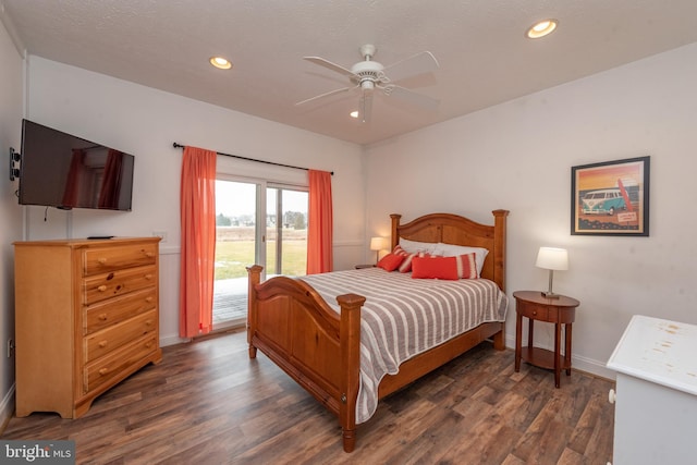 bedroom featuring access to outside, ceiling fan, and dark wood-type flooring