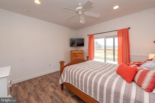 bedroom with dark hardwood / wood-style floors and ceiling fan