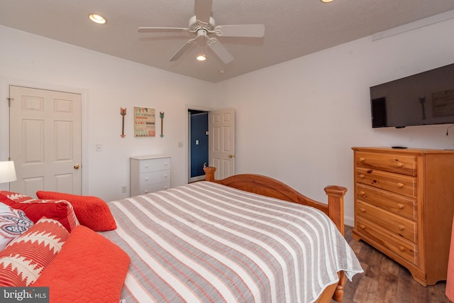 bedroom featuring hardwood / wood-style floors and ceiling fan