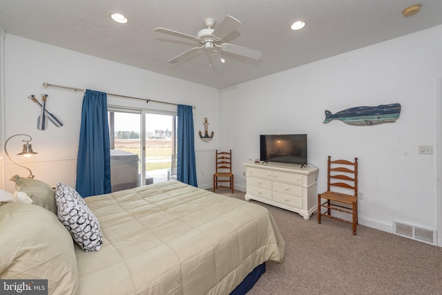 bedroom with access to exterior, a textured ceiling, carpet floors, and ceiling fan