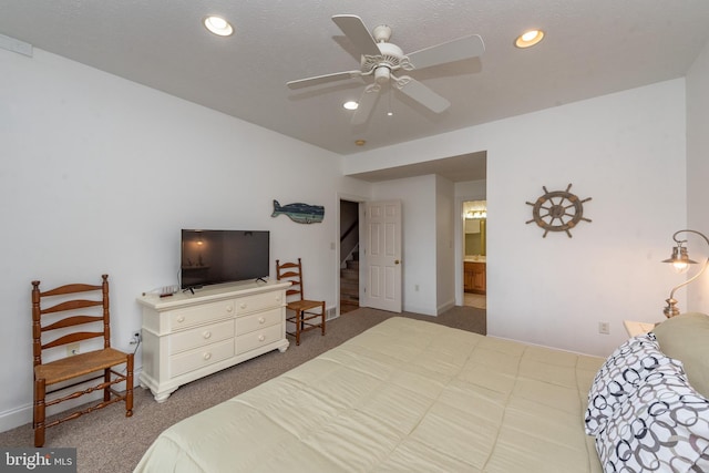 carpeted bedroom featuring connected bathroom and ceiling fan