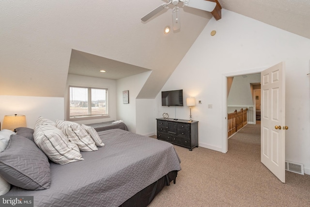 carpeted bedroom featuring ceiling fan and lofted ceiling with beams