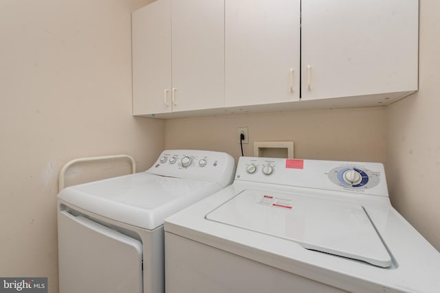 laundry area with cabinets and washer and dryer