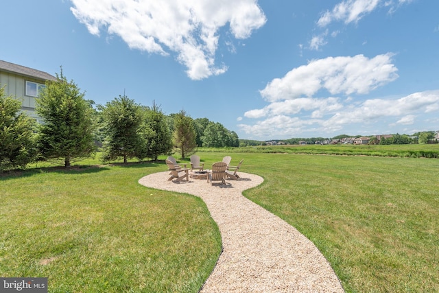 view of yard featuring a patio area and an outdoor fire pit