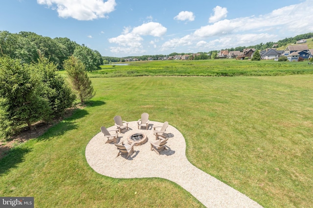 view of yard with an outdoor fire pit and a patio