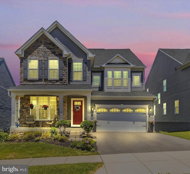 craftsman house with a garage and a porch