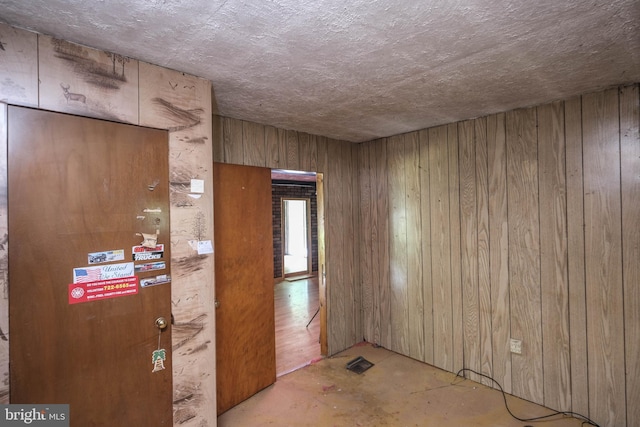 interior space featuring wood walls