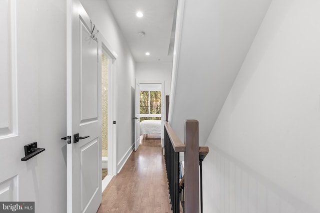 hallway with wood-type flooring