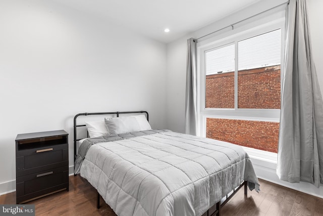 bedroom featuring dark wood-type flooring