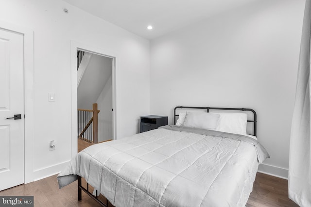 bedroom featuring dark hardwood / wood-style floors