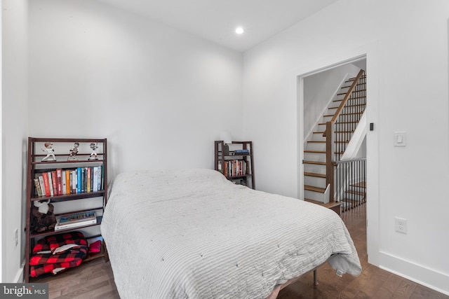 bedroom with hardwood / wood-style floors