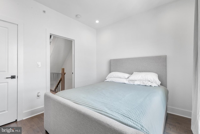 bedroom featuring dark wood-type flooring