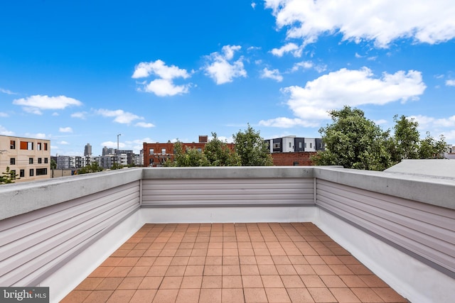 view of patio featuring a balcony