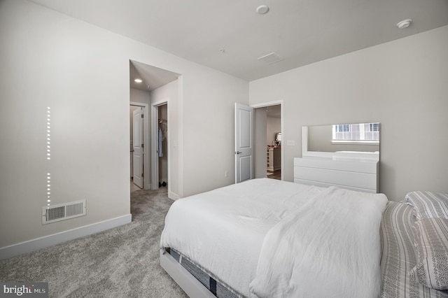 carpeted bedroom with a closet