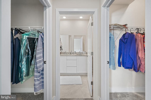 spacious closet with light carpet