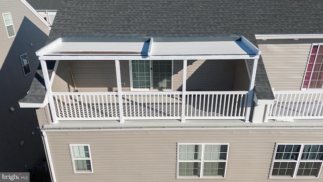 rear view of property with a balcony