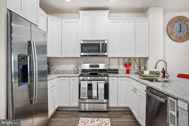 kitchen with white cabinetry, sink, and appliances with stainless steel finishes