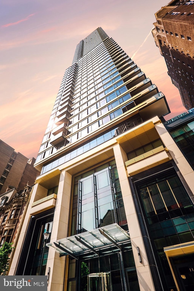 view of outdoor building at dusk