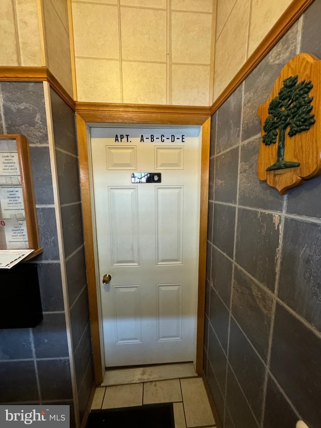 entryway with tile patterned floors