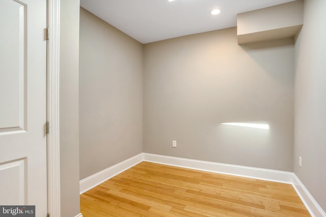 unfurnished room with hardwood / wood-style flooring