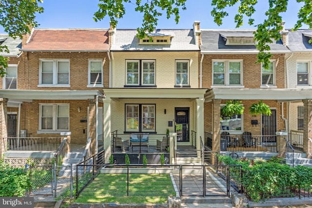 view of property with a porch