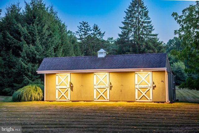 view of stable with an outbuilding