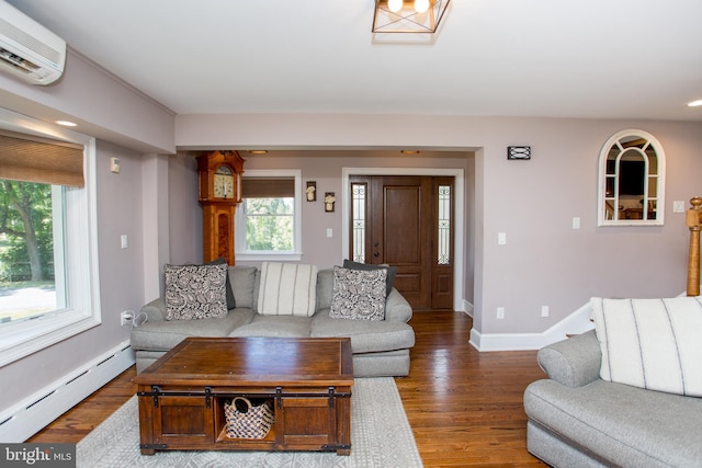 living room with dark hardwood / wood-style floors, an AC wall unit, and baseboard heating