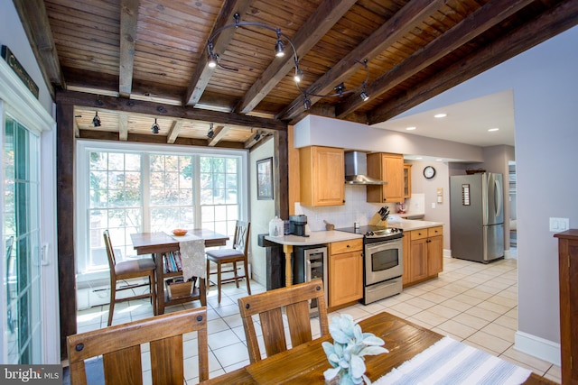 kitchen with light tile patterned floors, wood ceiling, and stainless steel appliances